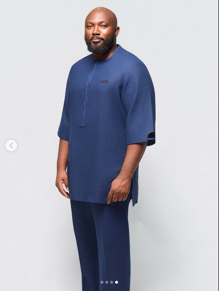 TNH model in a structured navy two-piece outfit
